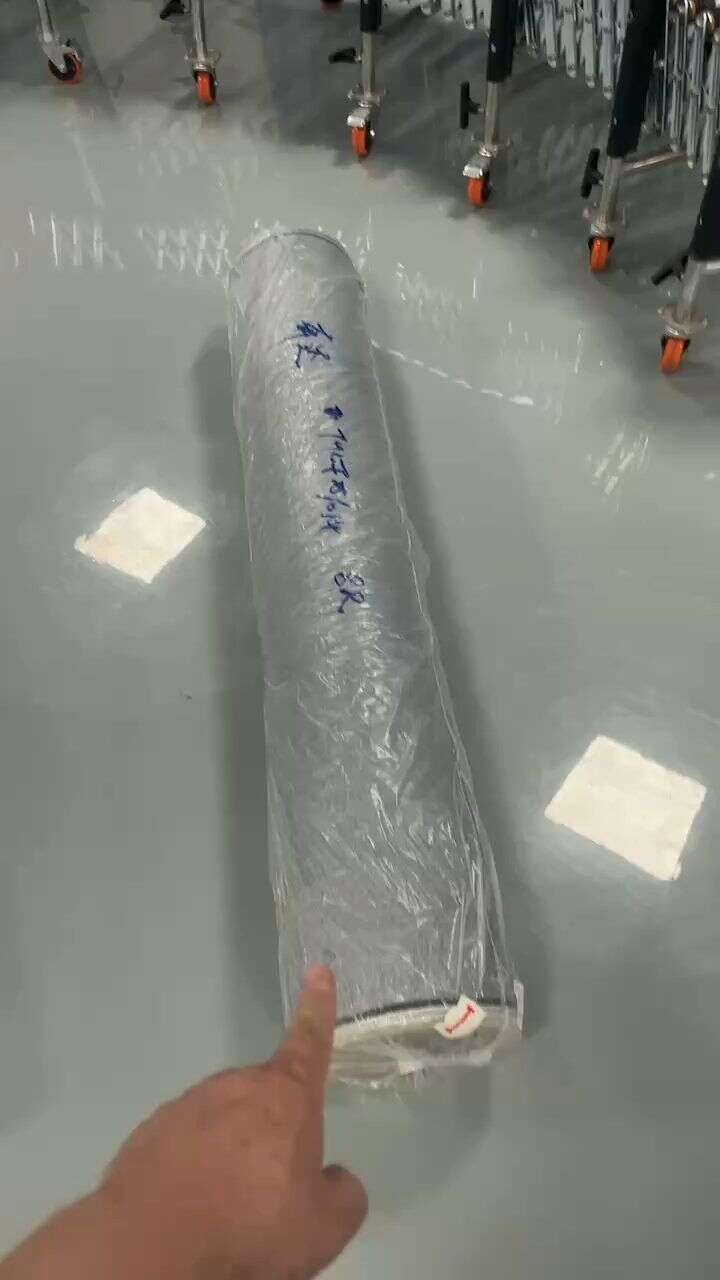 Medium Hydraulic Conveyor transporting rolls of fabric